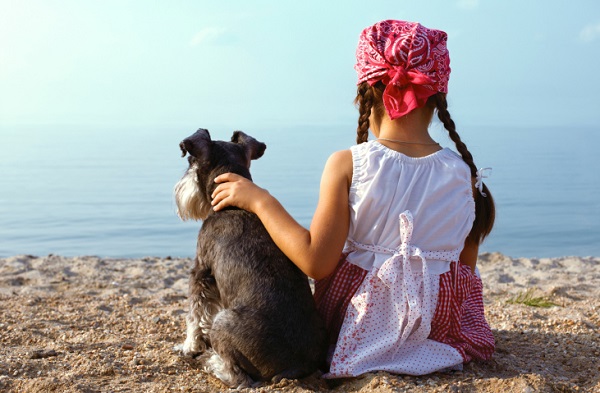 beautiful  girls embracing her dog